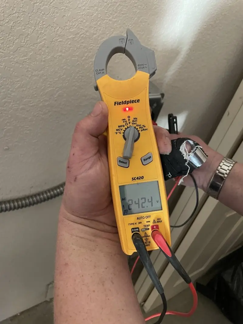 Voltage testing with clamp meter during Recessed Lighting Installation in Federal Way